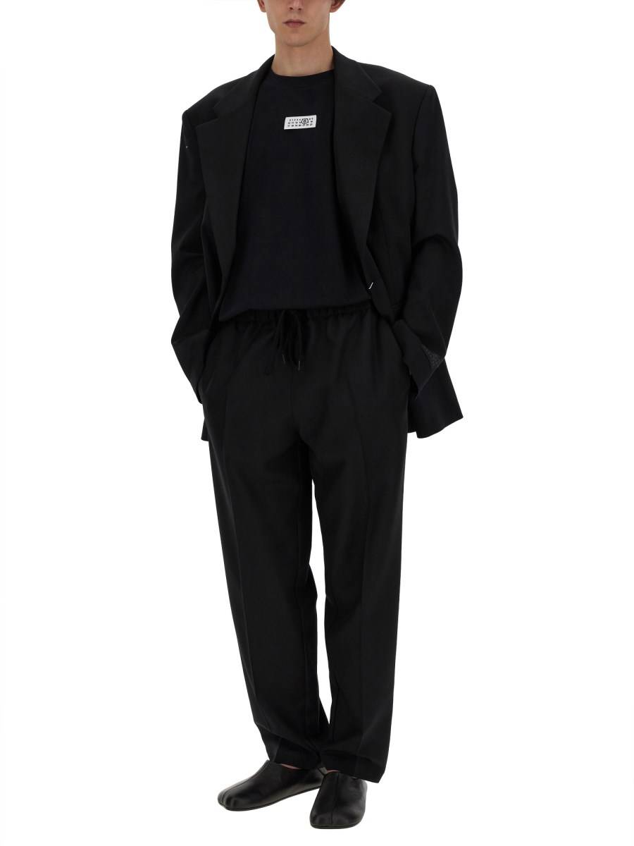 MM6 MAISON MARGIELA PANTALONE IN LANA CON GAMBA AFFUSOLATA 2025